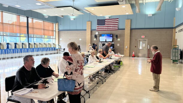 File: Poll workers at Westerly Middle School. Credit: David Wright/Ocean State Media
