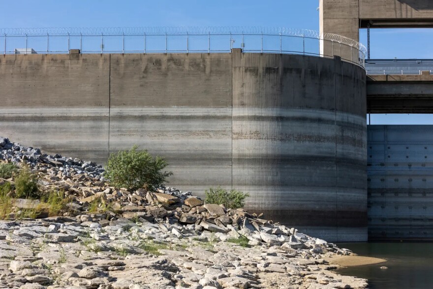 Water marks are seen on the gates and concrete at the Falcon Dam in Starr County on Aug. 18. This area of the reservoir is normally underwater, but because of an extended drought, water levels have been below 20% since earlier this year. 