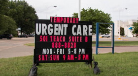 In 2018, a sign behind a closed hospital in Kennett, Missouri advertised a new urgent care center in 2018.