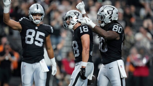 Las Vegas Raiders wide receiver Jack Bech (18) celebrates his touchdown against the Arizona Cardinals with Raiders tight ends Albert Okwuegbunam Jr. (85) and Ian Thomas (80) during the first half of a preseason NFL football game, Thursday, Aug. 13, 2026, in Las Vegas. (AP Photo/John Locher)