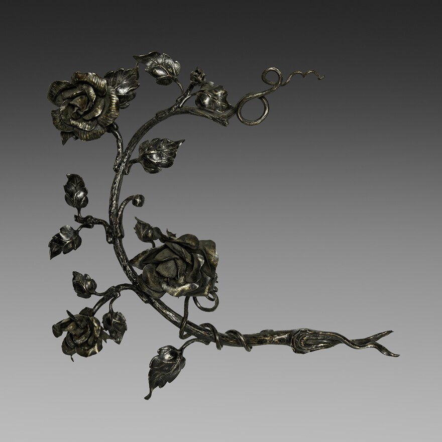 A delicate iron sculpture of roses