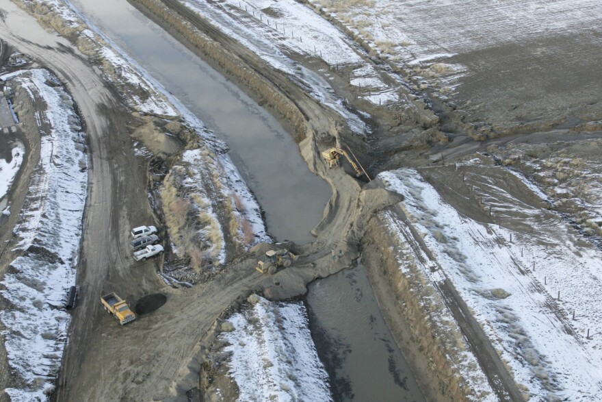 FILE -- A levee that broke flooding homes and forcing evacuations is shown in the process of being repaired in Fernley, Nev., on Jan. 6, 2008.
