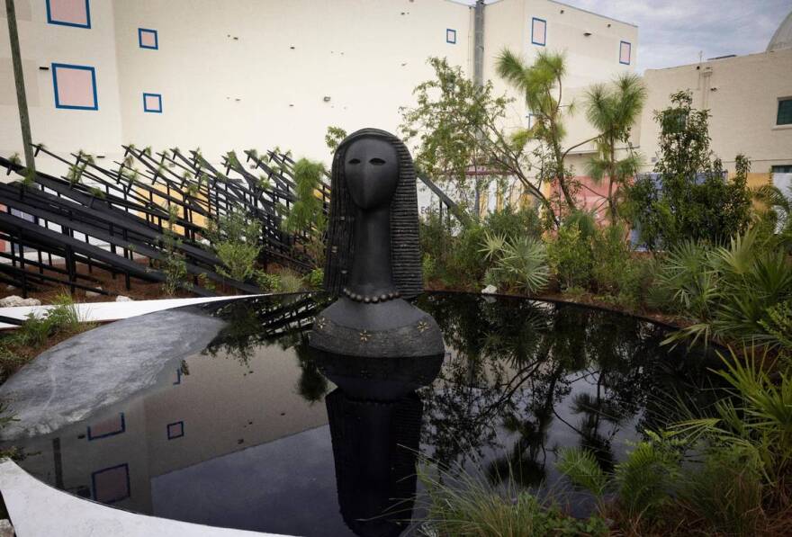 Yemaya, goddess of the living ocean and a cedar sculpture by Jems Robert Koko Bi, sits in the Garden of Humanity, a walk through exhibit during the “Art of Transformation” exhibit preview on Monday, Dec. 4, 2023, outside the ARC in Opa-Locka. 