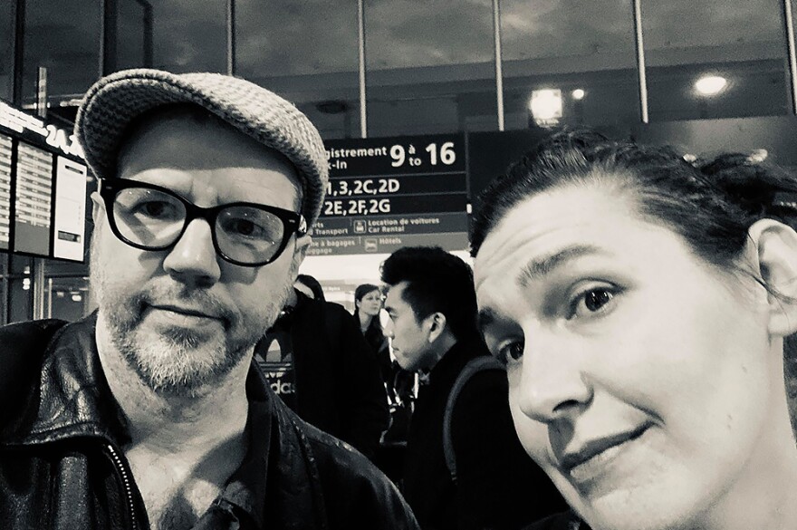 Johnny Hamil and his wife Cara take a selfie at the airport as they wait in line for their flight back to the States.