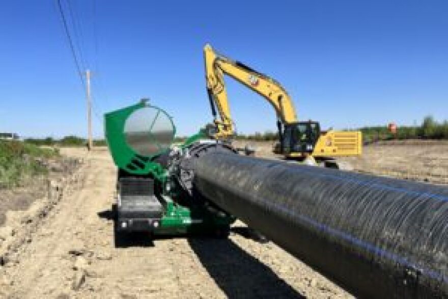 FILE, Contractors install the Arkansas Valley Conduit east of Pueblo.