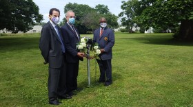 WIU Interim President Martin Abraham, Macomb Mayor Mike Inman, and Byron Oden-Shabazz, President of the McDonough County Branch of the NAACP (left to right) placed a wreath at the site of C.T. Vivian's boyhood home.