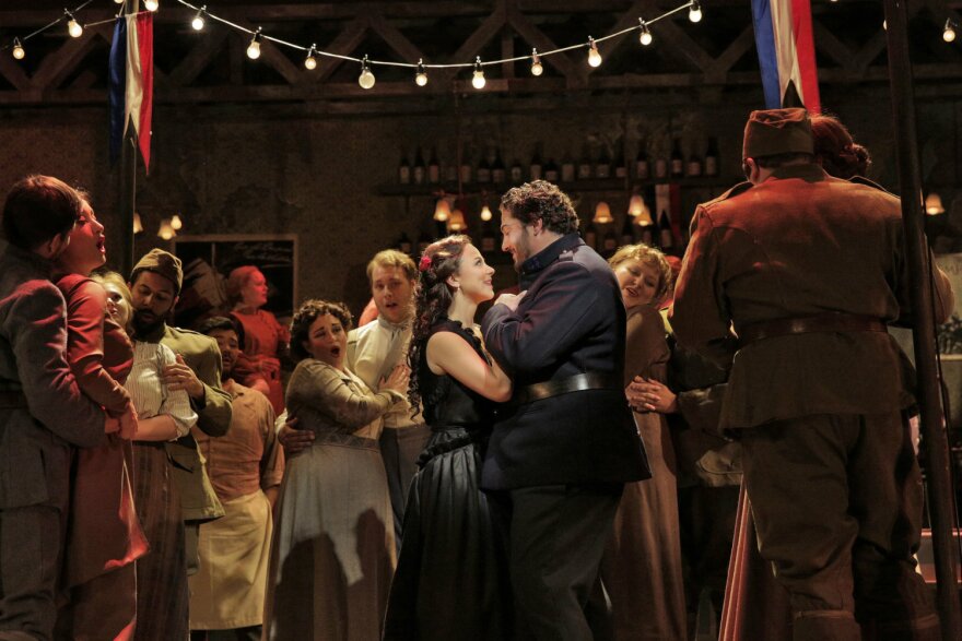 Corinne Winters as Magda and Anthony Kalil as Ruggero, with appreciation for the chorus, in La rondine'