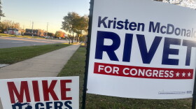 Campaign signs side by side in Saginaw for Republican U.S. Senate candidate Mike Rogers and Democratic Rep. Kristen McDonald Rivet in Saginaw