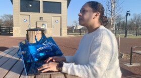 Taylor Ryan, founder and executive director of Change Today, Change Tomorrow and mom, checks on her son as she works at the Alberta O. Jones Park.