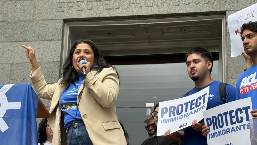 Doris Reina-Landaverde, coordinator for the Massachusetts TPS Committee, spoke at a rally focused on the termination of Haitian TPS in July.