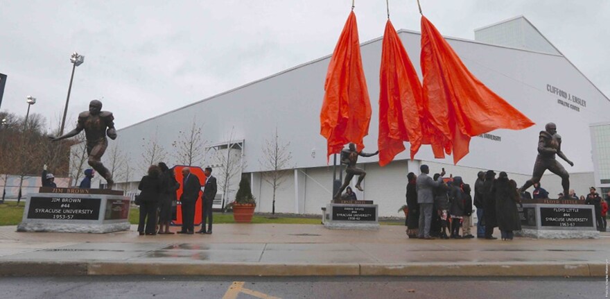 Unveiling the statues at Syracuse University's "Plaza 44" on November 14, 2015