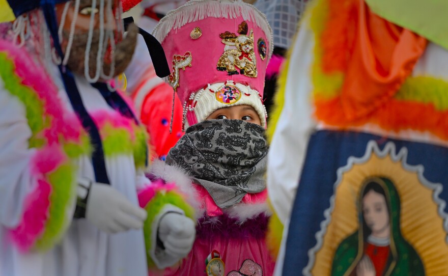 A young girl is dressed to dance with the Chinellos during Friday's Our Lady of Guadalupe procession in Wilkes-Barre.