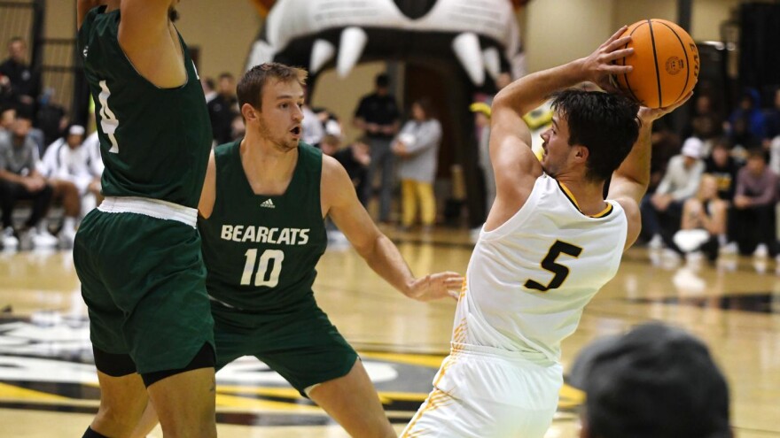 Action shot of Wes Dreamer vs Fort Hays State basketball