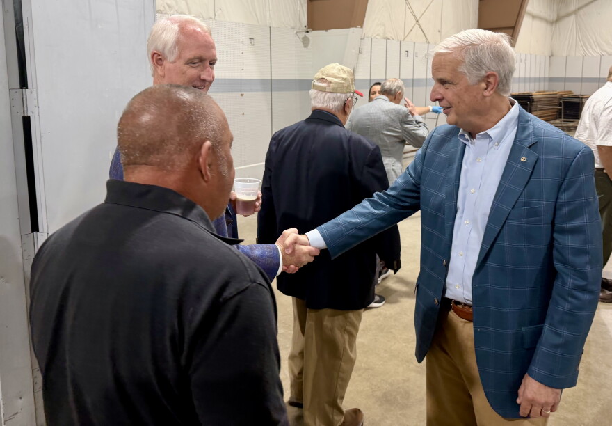 Virginia State Senator Mark Obenshain, right, greets attendees at his annual Oysters with Obenshain fundraiser on Oct. 14.