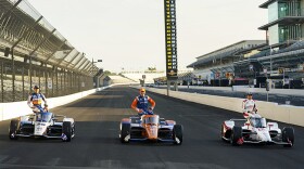 Marco Andretti, right, poses, with Scott Dixon, of New Zealand, center and Takuma Sato, of Japan, during the front row photos session for the Indianapolis 500 auto race at Indianapolis Motor Speedway in Indianapolis, Monday, Aug. 17, 2020. Andretti won the pole for Sunday's race.