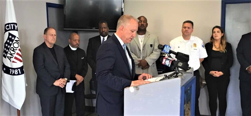 Akron Mayor Dan Horrigan addresses recent shootings during a news conference at the Akron Police Department Monday.
