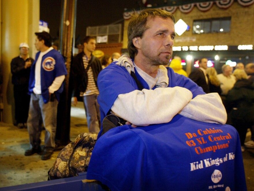 <p>Ted Zegarski and other dejected Cubs fans hang out in front of Wrigley Field as the Chicago Cubs were beaten by the Florida Marlins in Game 7 of the National League Championship Series on Oct. 15, 2003.</p>