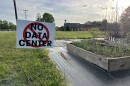 No data center sign stands in a Rural Hall field