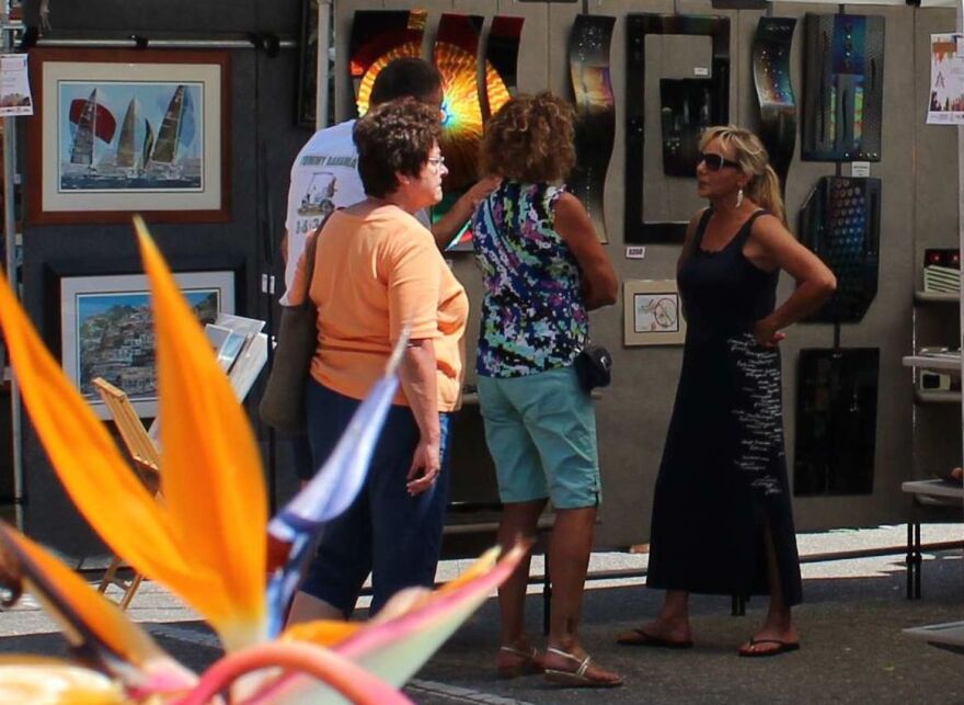 Bird of Paradise provides colorful backdrop for Naples Downtown Art Fair