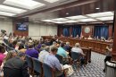 Attendees and board members at a previous Board of State Canvassers meeting.