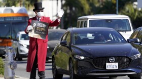 Gregg Donovan demonstrates with a sign protesting the lack of Black members in the Hollywood Foreign Press Association, outside the 78th Golden Globe Awards at the Beverly Hilton, Sunday, Feb. 28, 2021, in Beverly Hills, Calif.