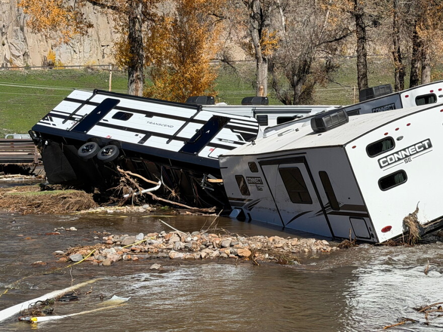 A flooded campground and damaged RVs.