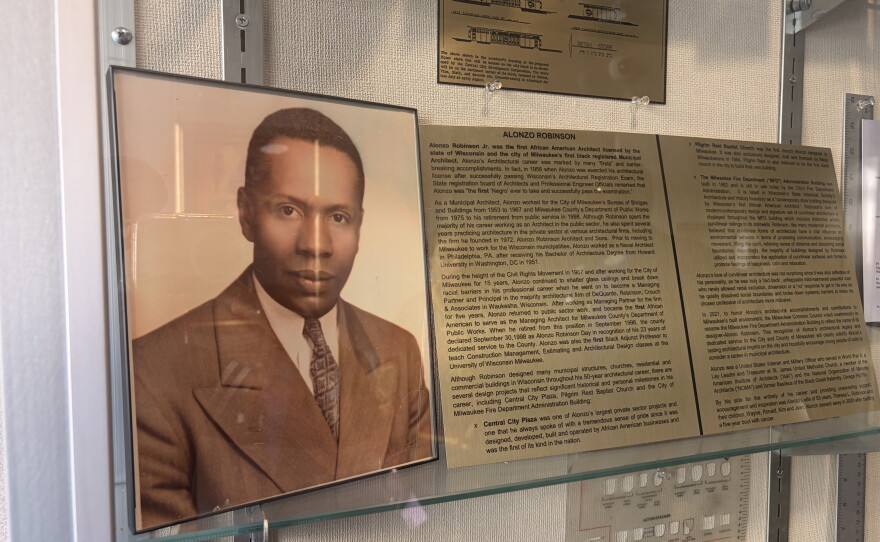Inside the entrance of the Milwaukee Fire Department headquarters, there's a display case with photos, tools, and other memorabilia dedicated to Alonzo Robinson Jr.