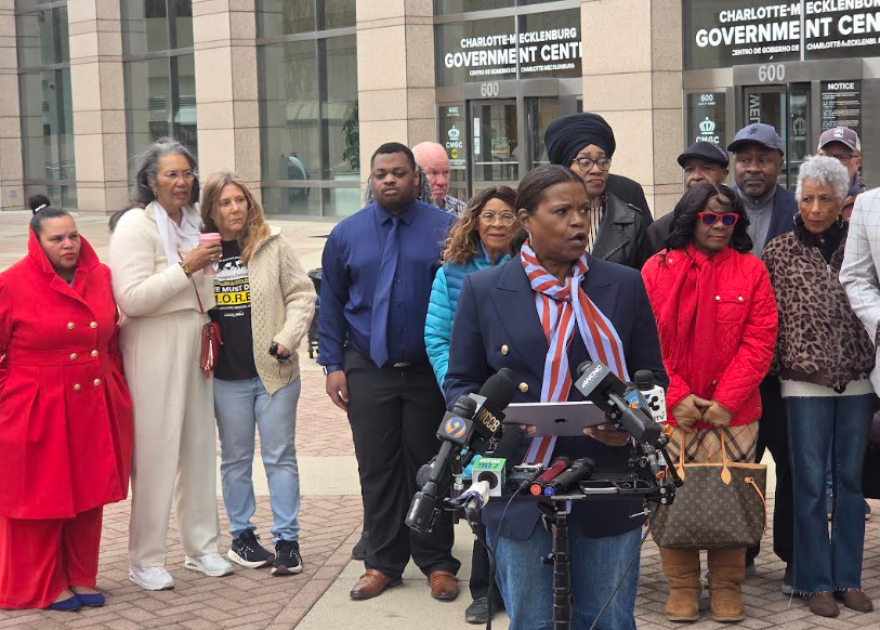 Black Political Caucus President Jocelyn Nolley speaks at a news conference Monday. The BPC says it will file a lawsuit to halt plans to build new toll lanes on Interstate 77.