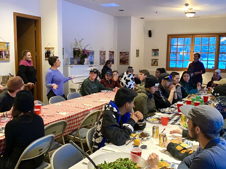 Deborah Madsen welcomes dozens of guests with a blessing at the weekly “Kind Neighbor” dinner at the Snowmass Chapel on Thursday, Feb. 1, 2024. During her welcome remarks, Madsen also made sure people were aware of the new food pantry at the Snowmass Village Town Hall.