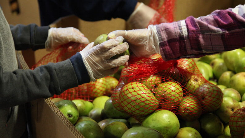 States are taking an out provided by Congress to avoid cutting food stamp benefits to families, many of whom already depend on food banks like the Alameda County Community Food Bank in Oakland, Calif.