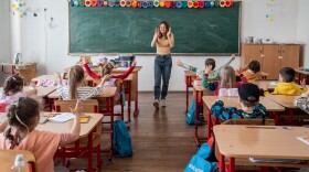 Anastasiia Konovalova of Odesa, Ukraine, teaches an English class to young Ukrainian refugee children at a high school called Mihai Viteazul National College in Bucharest on April 6.