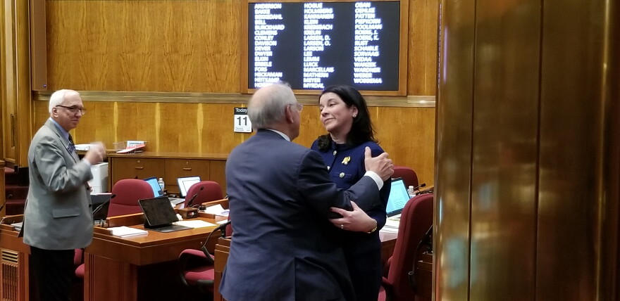 Sen. Nicole Poolman (R-Bismarck) embraces Sen. Tim Mathern (D-Fargo), after announcing she won't seek re-election.