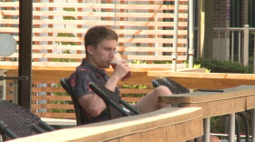 A customer enjoys a beer at Switchyard Brewery in Bloomington on June 15th, 2020.