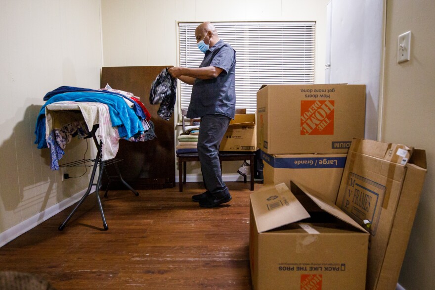 Gregory Curry has had almost all his belongings in boxes and in a storage locker since he was evicted in August. He spent more than seven months struggling to survive financially and unable to find another landlord willing to rent to him. [Colin Hackley for NPR]