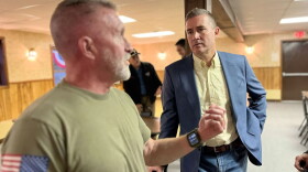 Blake Gendebien, right, speaking with Joe Fisher, an independent voter who attended Gendebien's recent event at the VFW in Saranac Lake, New York.