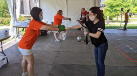 University of Illinois graduate student Kristen Muñoz submits her saliva sample for COVID-19 testing on the Urbana campus.