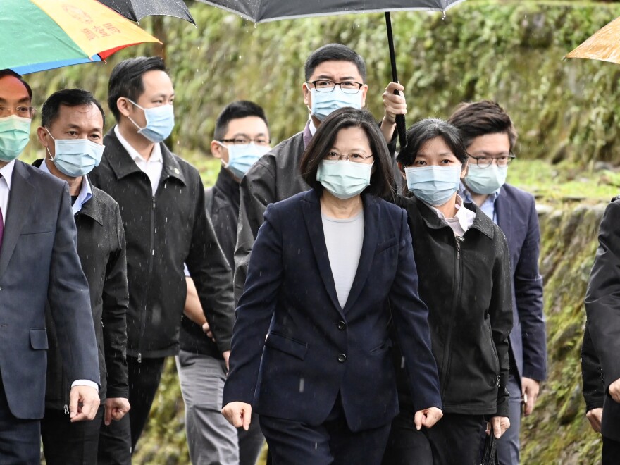 Taiwan President Tsai Ing-wen (center) arrives at a ceremony to unveil Taiwan's Cyber Security Investigation Office on April 24. Tsai was re-elected in January amid an upsurge in anti-China sentiment, spurred by months of street protests in neighboring Hong Kong.