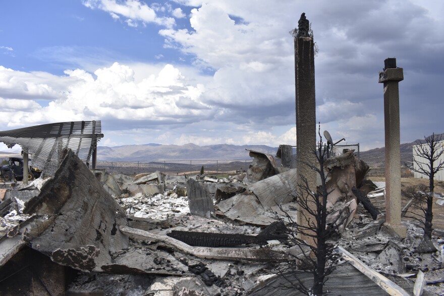 Pillars that once held up the entrance of Michelle and Gil Lucero’s home, which was burned in the Bug Fire, in Red Rock, Nevada, on Aug. 14, 2026.