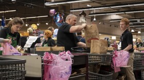 Employees at Dierbergs in Ballwin bag customer groceries on March 21, 2020. Local grocery stores have been particularly busy in recent weeks, as shoppers rush to stock up on essentials during the COVID-19 pandemic.