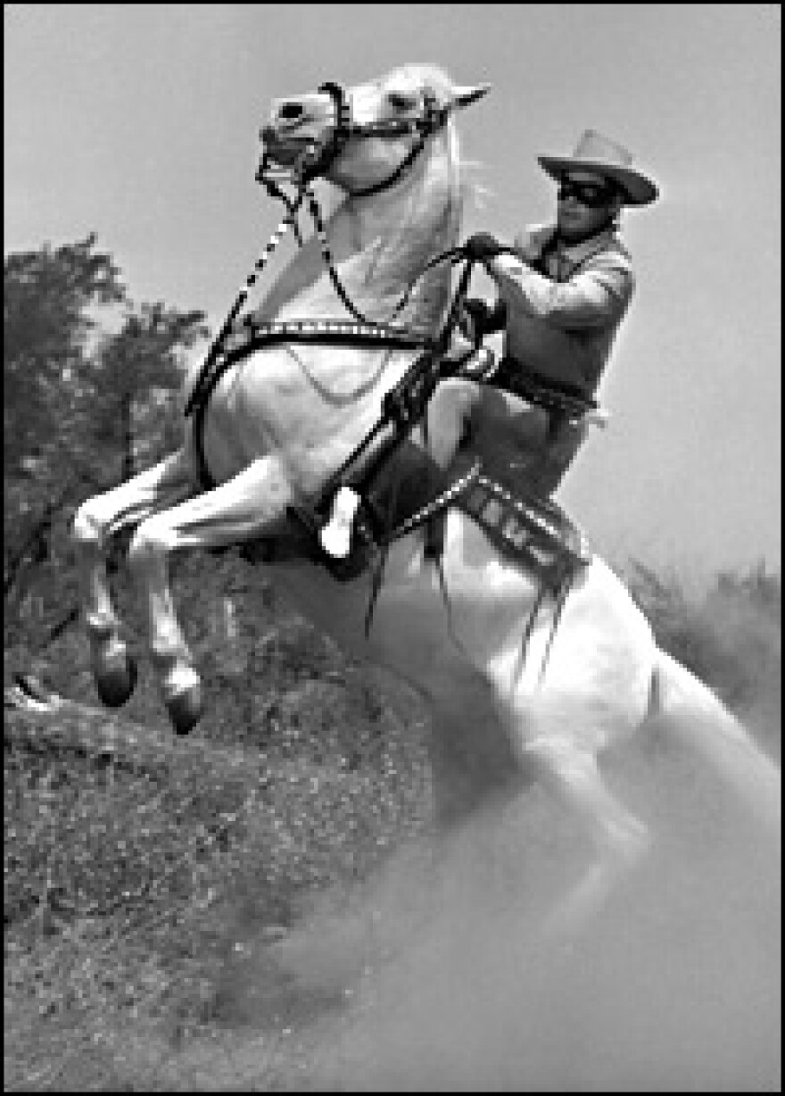 Actor Clayton Moore — TV's Lone Ranger — rides to the rescue circa 1955.