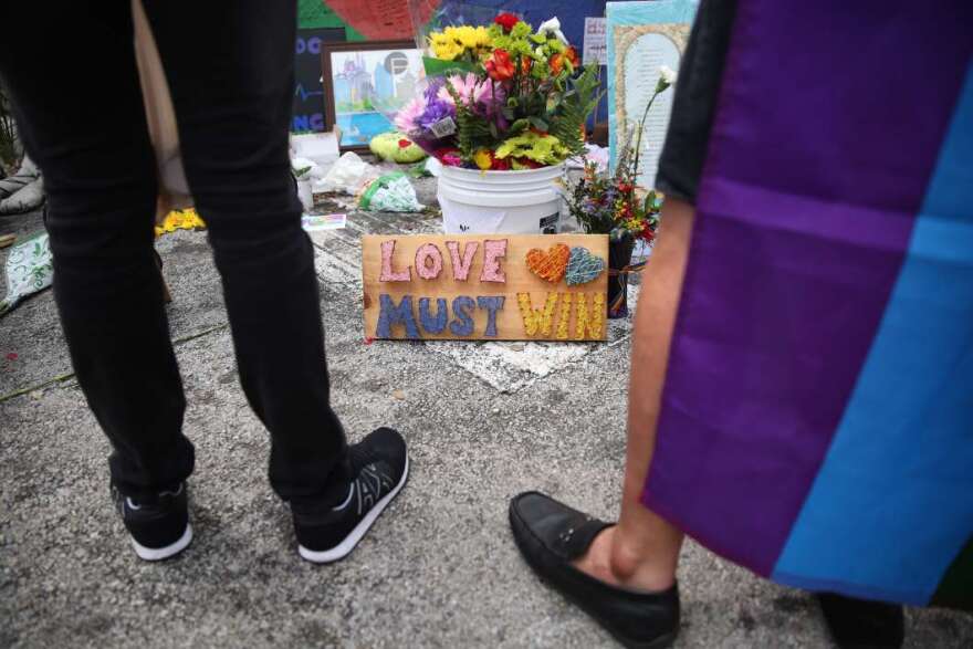 One year after the Pulse shooting, the community gathers at the club for vigils and remembrance. Photo: Joey Roulette