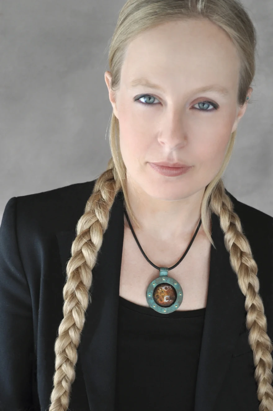 Portrait of a woman with blonde hair in braids