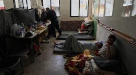 Displaced people fleeing Israeli airstrikes in southern Lebanon settle at the Bir Hassan Technical Institute, which has been turned into a shelter, in Beirut, Lebanon, Wednesday, March 11, 2026. (Bilal Hussein/AP)