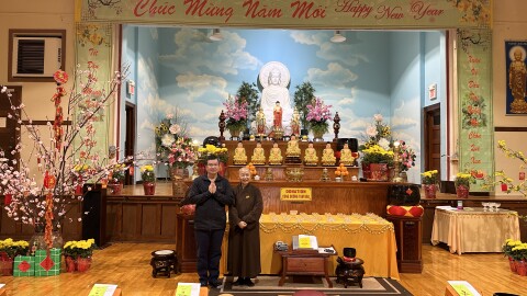 Buddhist nun Thich Tinh Nghia stands with community member Nguyên Trieu before leading the Year-End and Ancestor Memorial ceremony.