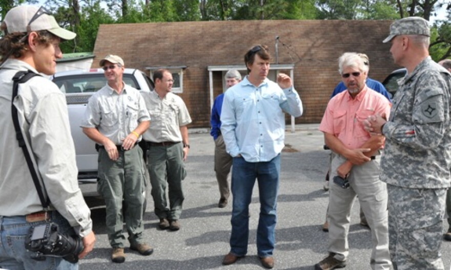 Expedition members greet Land Component Commander Army Brig. Gen. Richard Gallant (right) and Florida Fish and Wildlife Conservation Commission at Camp Blanding.
