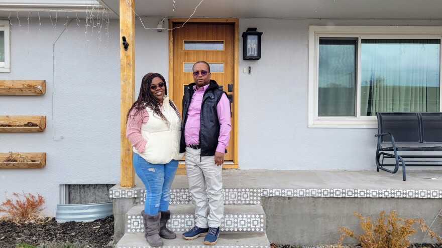 Houefa Akpamoli and her husband Arnold Akele in front of their home in Fort Morgan, Colo., on March 8, 2024. They were the first tenants to move into Sol Naciente when it opened in 2016. They were forced to leave about year later, after Akele's income exceeded the annual limit by $10. "We didn't know when we moved in that we would have to leave after just one year," Akpamoli said.