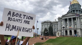 Dozens of people protested the Supreme Court's ruling outside the state Capitol on Friday.