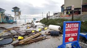A public facility and life guard tower are seen partially collapsed near the Pirates Cove condominium due to a storm surge by Hurricane Nicole Thursday, Nov. 10, 2022, in Daytona Beach Shores, Fla. (AP Photo/John Raoux)