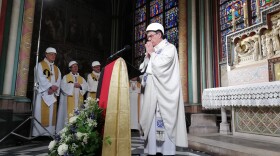 A small group in hard hats gathered on Saturday for Mass in Paris' Notre Dame cathedral. It was the first Mass since a fire devastated the church in April. Karine Perret/AFP/Getty Images