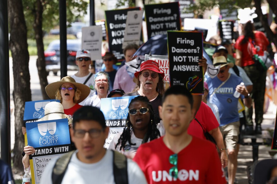 Union members, elected officials and allies from the community take part in a rally towards Dallas Black Dance Theatre.